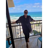 Reviewer Jessica Harrison's photo: woman on a beachside balcony